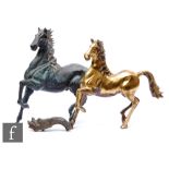 A 20th Century bronze model of a prancing horse, height 41cm, and a similar brass prancing horse,