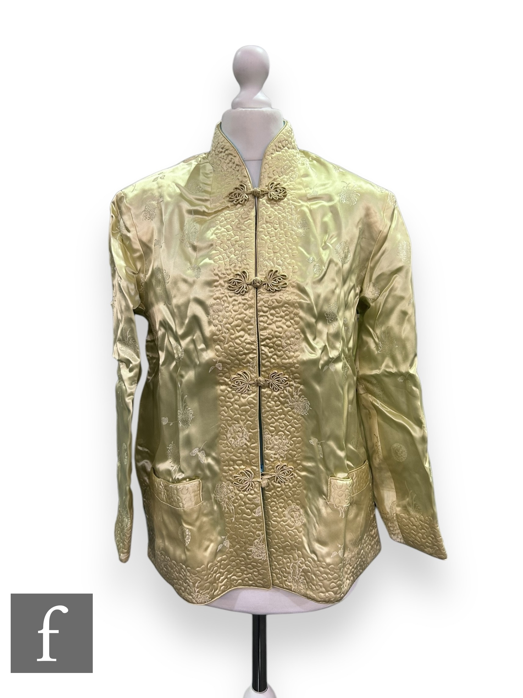 A 1950s Peony Brand lady's Chinese style reversible jacket with floral sprays in pale yellow and