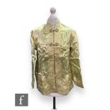 A 1950s Peony Brand lady's Chinese style reversible jacket with floral sprays in pale yellow and