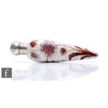 An early 20th Century glass lay scent bottle of torpedo form, the opaque glass painted with