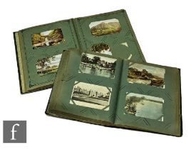 An Edwardian album of postcards containing  views, street scenes and real photographic cards and a