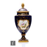 A Coalport porcelain pedestal vase, circa 1900, of pedestal form with campana urn form, raised on