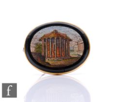 A Victorian Grand Tour micro-mosaic memorial brooch, the unmarked yellow metal surround with