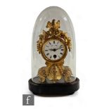 A small 19th Century French gilt metal mantle clock, the dial surmounted with a bird's nest and