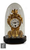 A small 19th Century French gilt metal mantle clock, the dial surmounted with a bird's nest and