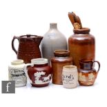 A collection of 19th and 20th Century stoneware jugs, pitchers and jars, to include a French Liqueur