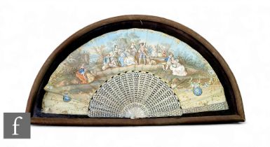 A 19th Century French mother of pearl framed fan, the densely carved gilded mother of pearl twenty