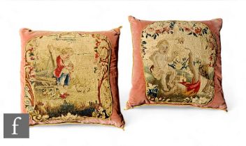 A pink cushion with gold coloured braided edge mounted with a 19th Century needlework panel of two