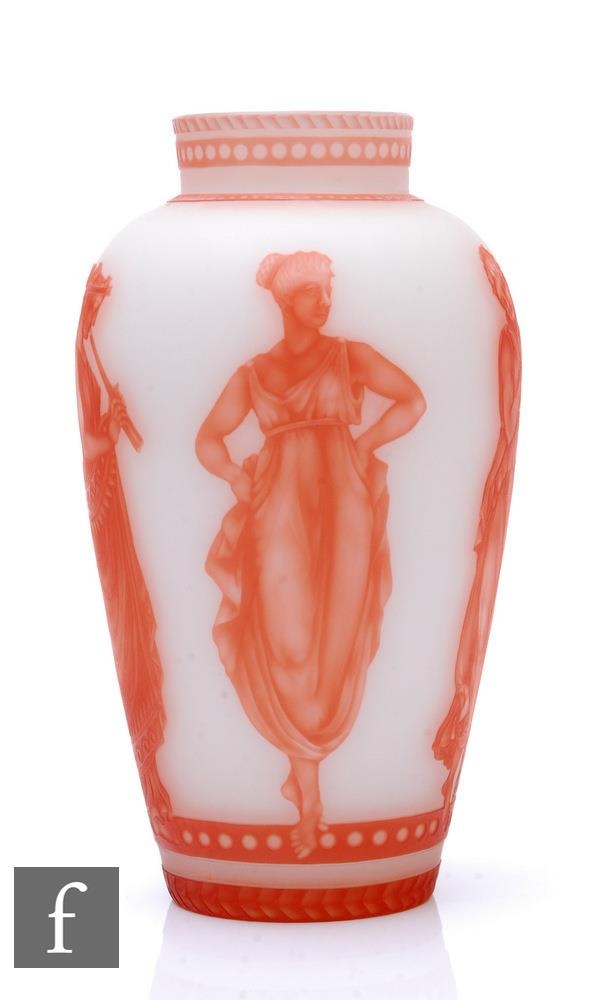 A late 19th Century cameo glass vase of ovoid form with collar neck, cased in deep amber over opal