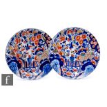 A pair of 19th Century French faience plates, each of circular form decorated in the Chinese taste
