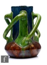 An early Belgian Torhout art pottery vase, of baluster form with four handles applied to a