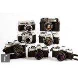 A collection of Minolta 35mm rangefinder cameras, to include SRT 101, two XG – 9, AL-S, XG-1, A, 7s.