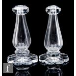 A pair of late 19th to early 20th Century French clear crystal candlesticks by Baccarat, the facet