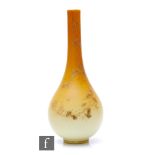 A late 19th Century continental glass vase by Harrach, of footed ovoid form with tall slender