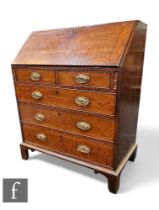 A George III oak country bureau, the fitted drawer and pigeon hole interior enclosed by a fall