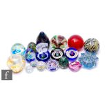 A collection of assorted 20th Century paperweights to include millefiori, lampwork and iridescent
