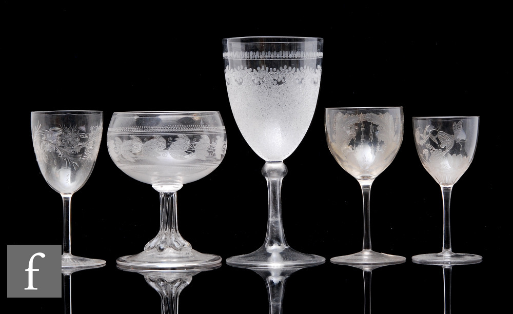 A 19th Century Stourbridge clear crystal wine glass, the pointed round funnel bowl with a rolling