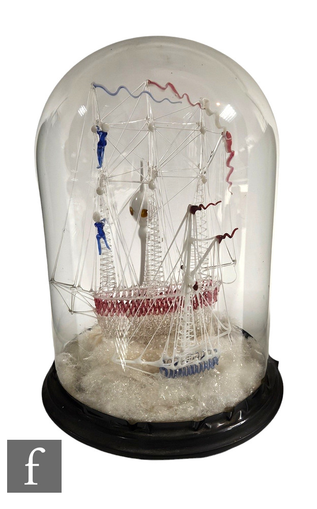 A 19th Century glass diorama, internally decorated with rigger work stylised ships and lighthouse,