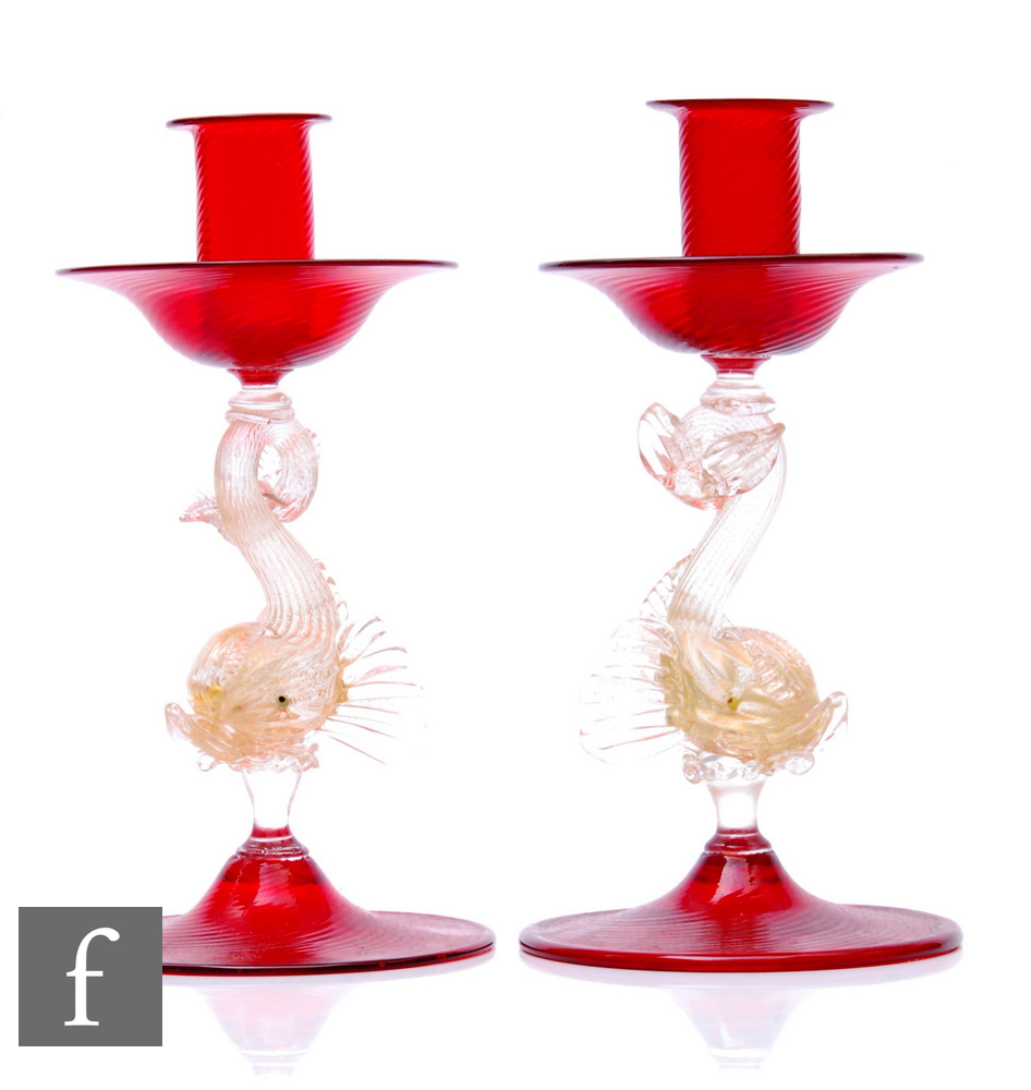 A pair of 20th Century Italian Murano glass candlesticks in the manner of Savliati, the deep red