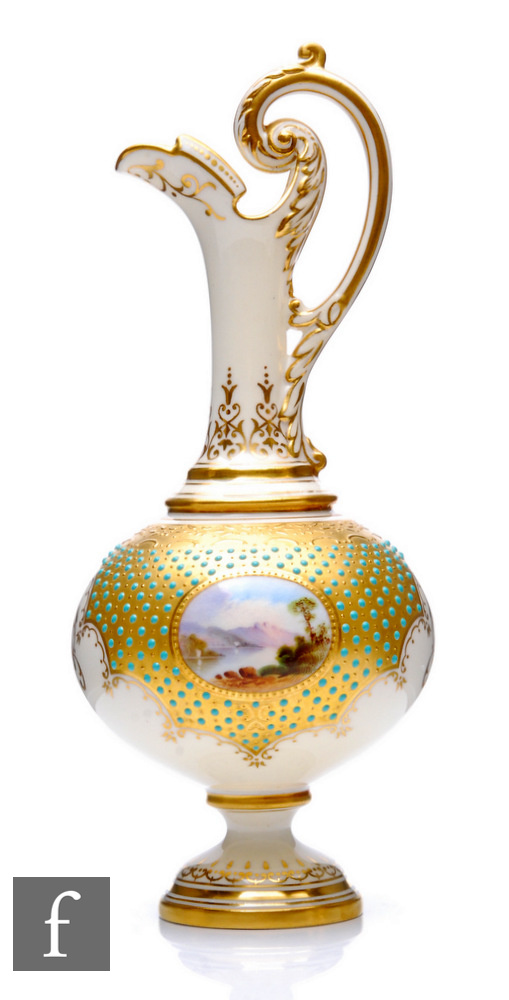 A Coalport porcelain pedestal ewer of footed slender form, rising from a spreading circular base