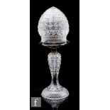 A 1920s clear crystal table lamp, of baluster form with mushroom shade, all with hobnail cut