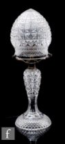 A 1920s clear crystal table lamp, of baluster form with mushroom shade, all with hobnail cut