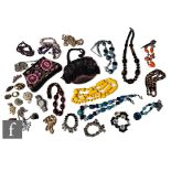 A quantity of costume jewellery, including necklaces, beads, beadwork bags, a 9ct gold ring and