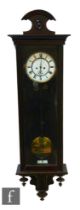 A 20th Century weight driven wall clock, circular enamelled dial enclosed by a glazed door, height