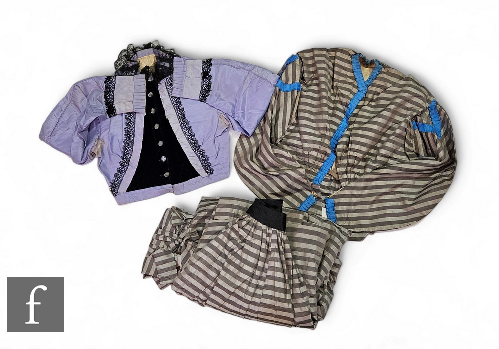 A Victorian lady's two piece dress, the jacket with blue ruffle trim over grey and silver stripe