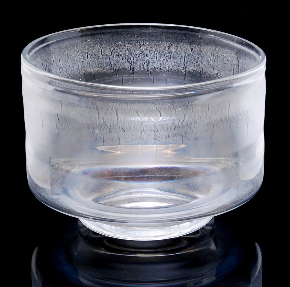 A large later 20th Century Leerdam glass bowl with small circular foot below a wide cylindrical body