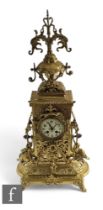 A large Victorian style brass mantle clock in the Renaissance style, Arabic dial with eight day