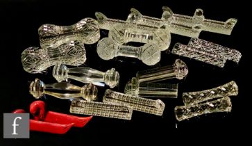 A large quantity of 19th and 20th Century assorted clear crystal knife rests, mostly pairs, of