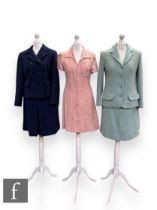 A 1960s Jaeger wool two piece suit, comprising fitted jacket with two pockets and midi pencil skirt,