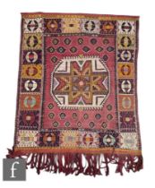 An Iranian Ardebil hand knotted wool rug/wall hanging, circa 1960, the red ground with central