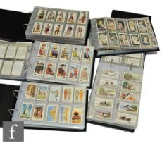 An extensive collection of sets of cigarette cards contained in five albums, to include Wills,