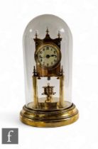 An Edwardian brass 365 day clock by Gustave Becker, the movement stamped, in glass dome case on