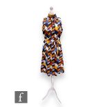 A 1960s vintage silk sleeveless shift dress, with high collar neck and original tie waist belt,