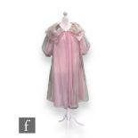 A 1950s/60s light pink organza night gown, with short puff sleeves and oversize layered collar.