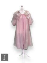 A 1950s/60s light pink organza night gown, with short puff sleeves and oversize layered collar.