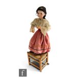 A 1920s automaton of an Armand Marseille 390 doll as a Gypsy girl wearing lace edge blouse and
