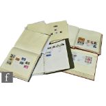 A large of collection of British first day covers contained in five albums, also some mounted mint