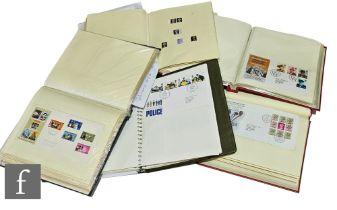 A large of collection of British first day covers contained in five albums, also some mounted mint