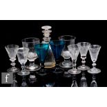 A collection of 18th Century and later glassware to include a small crystal glass spirit decanter of