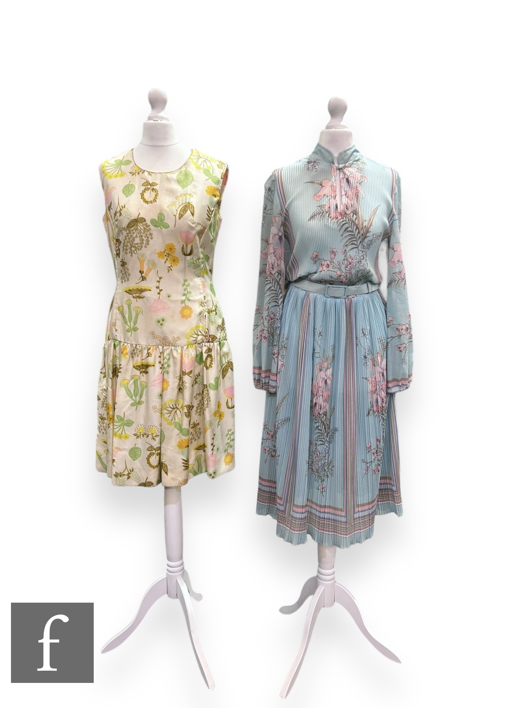 A 1960s vintage high neck sleeveless mini dress, with drop waist with stylised floral motifs in