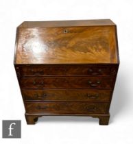 A 19th Century mahogany bureau, the fall front enclosing an arrangement of drawers, above four