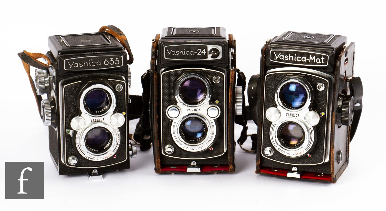 A collection of three Yashica medium format twin lens reflex film cameras, circa 1970s, to include