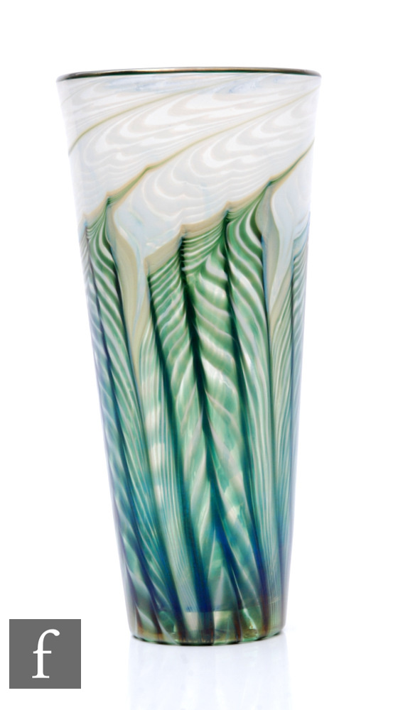 A contemporary Lundberg Studios glass vase, of tapering sleeve form, decorated with pulled opal