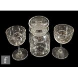 A pair of Whitefriars wine glasses, each with cup bowl finely engraved with stars above a plain stem