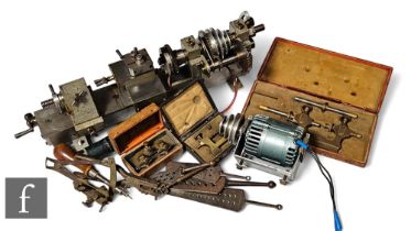 A small engineer's lathe with motor length and accessories including a cased Jacot tool and watch