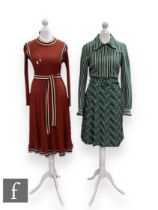 A 1970s vintage Jersey Ware knitted dress with long sleeves, button up detail to the green, black